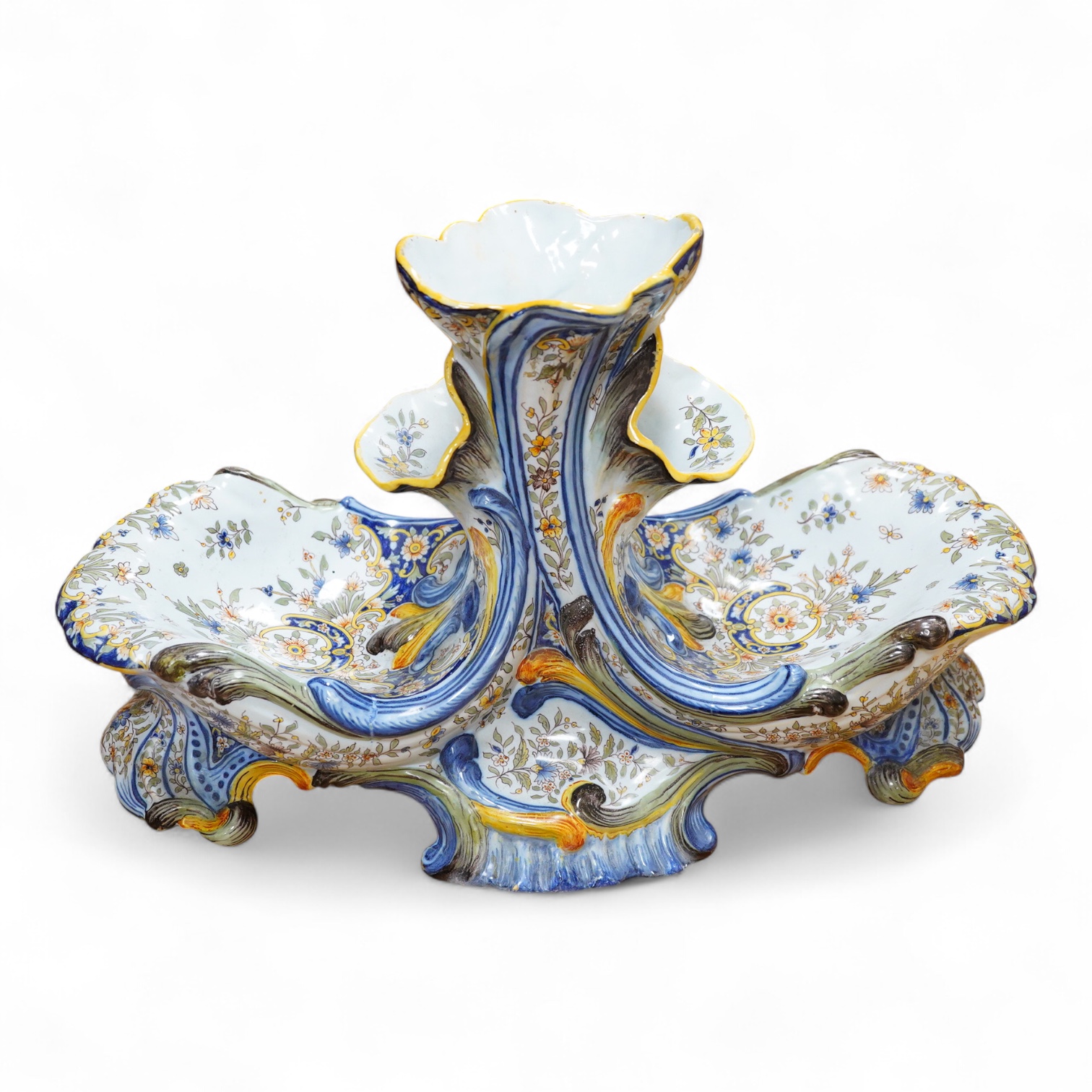 A large decorative French faience shell shaped centrepiece with central vase sections for flowers, 33cm high